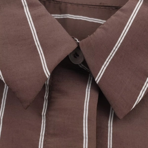 Detailed close-up of brown striped shirt collar and buttons with high-quality fabric texture