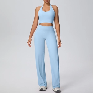 Detail view of light blue halter yoga top and high-waisted wide-leg sports trousers