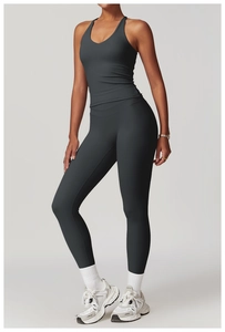 Detail of dark grey criss-cross back yoga vest and high-waisted leggings set