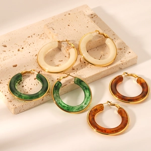 French vintage resin hoop earrings in marble green, amber, and cream with gold trim