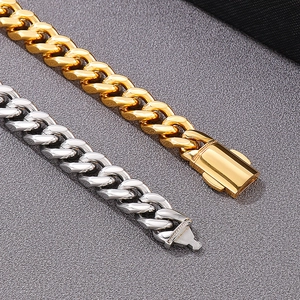 Detailed view of polished gold and silver Cuban link chains with secure box clasps