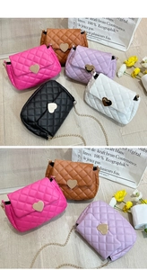 Flat lay of quilted leather chain bags with heart locks in five stylish colors