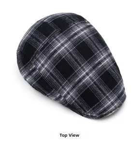 Top view of classic black and grey plaid newsboy cap showing fine woven fabric texture