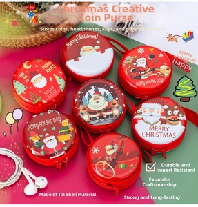 Close-up of assorted round tinplate Christmas coin purses with festive cartoon patterns