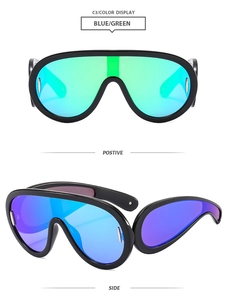 Front and side view of Y2K futuristic oversized sunglasses with blue green gradient lenses