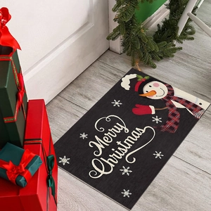 Christmas snowman door mat on wooden floor with festive gift boxes and pine wreath decor