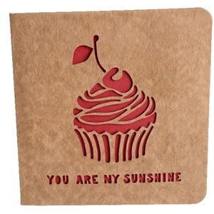Creative kraft paper greeting card with hollow cupcake design and you are my sunshine text
