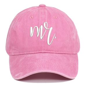 Close-up of pink washed cotton baseball cap featuring mr embroidery and curved brim
