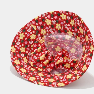 Detailed view of red floral sun hat with breathable white mesh lining and neat stitching
