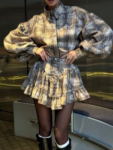 Elegant plaid two-piece set featuring puff sleeve shirt and ruffled skirt for women