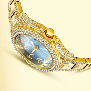 Macro shot of gold crystal-encrusted watch case with sunray blue dial and rich details