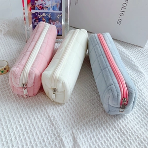 Plush quilted stationery pouch in pink, white, and blue with large storage capacity