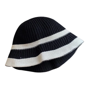 Modern black and white striped knitted bucket hat with a minimalist retro bell-shaped design