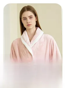 Detail of soft pink flannel bathrobe featuring a contrasting white shawl collar design