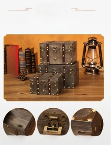 Detailed view of vintage wooden storage boxes with retro bronze locks and leather trim