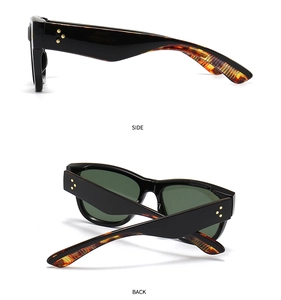 Cat eye sunglasses detail with golden star rivets on tortoise shell and black temples