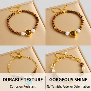 Close-up of golden tiger eye stone bracelets with heart charms and elegant pearls