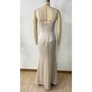 Detail of champagne satin evening dress featuring an open back and hidden zipper closure
