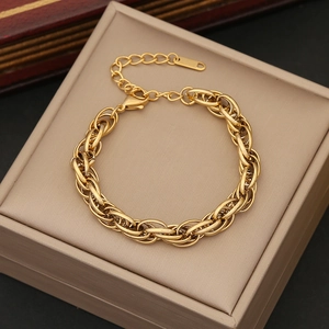 Detail of gold woven chain bracelet with lobster clasp and adjustable extension chain