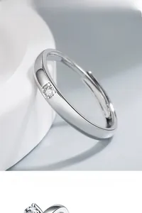 Close-up of a silver adjustable solitaire ring with a sparkling round-cut zircon stone