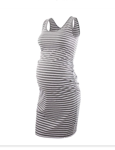 Side view of grey and white striped sleeveless maternity dress showing slim fit design