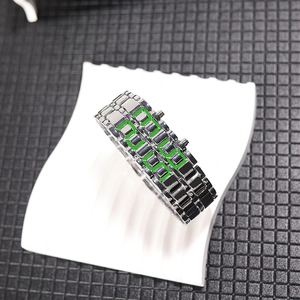 Detail view of the metal LED digital bracelet watch with glowing green numeric display