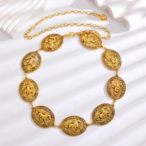 Close-up of bohemian gold chain belt featuring vintage horse relief carvings on oval metal plates