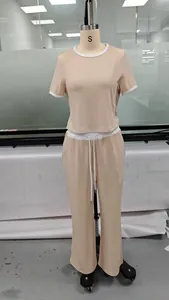 Detail of ribbed knit short sleeve set with contrast piping and adjustable drawstring