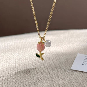 Elegant gold chain necklace with pink tulip flower pendant and white pearl detail