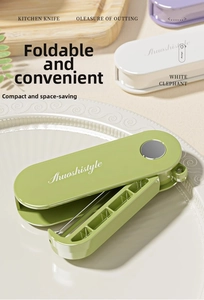 Detail shot of a foldable avocado green vegetable peeler on a white embossed ceramic plate