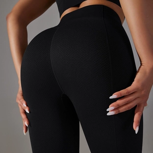 Close-up of black high-waisted seamless yoga pants showing butt-lifting compression texture