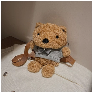 Detail of cute brown plush teddy bear bag wearing a grey hoodie with a woven strap