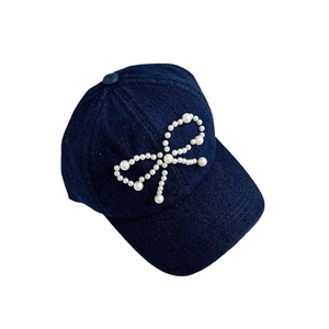 Navy blue denim baseball cap with pearl bow embroidery and curved brim for women