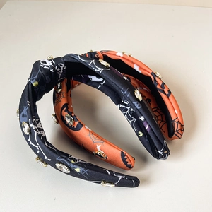 Set of two Halloween headbands with rhinestone pumpkin, spider web and skull patterns