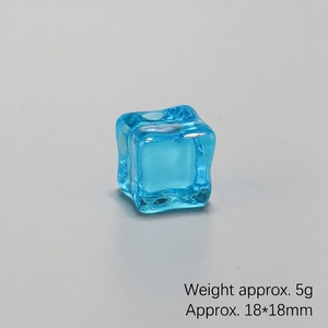Macro shot of a 18x18mm blue translucent resin ice cube decor weighing 5g for DIY crafts