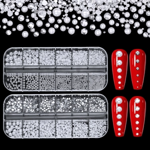 Mixed set of white nail pearls and rhinestones in storage boxes with nail art display