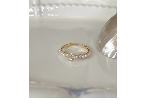 Detailed close-up of S925 silver flower ring with marquise zircons and white pearls