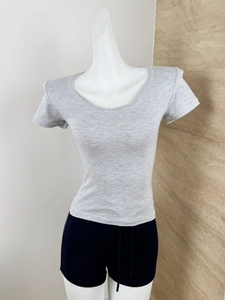 Detail of grey slim fit U-neck T-shirt showing marled knit fabric texture and stitching