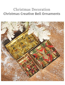 Golden Christmas bell ornaments with red Merry Christmas bows on a snowy pine surface