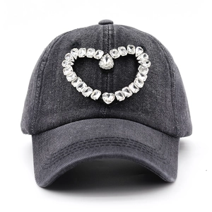 Washed dark grey denim baseball cap with heart rhinestone pattern and distressed detail