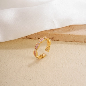 Adjustable gold plated ring with pink rectangular crystals and clear zircon accents