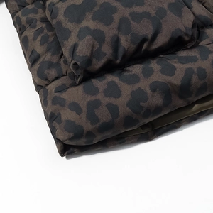 Close-up of leopard print puffer jacket showing smooth fabric and thick padding detail