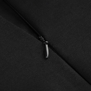 Close-up of the invisible zipper and fine knitted texture on the black party dress