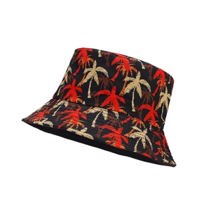 Reversible bucket hat with red palm tree pattern on black twill cotton for beach sun protection