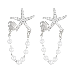 Detail of starfish earrings with sparkling rhinestones and elegant faux pearl tassels
