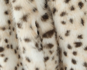 Close-up of leopard print faux fur texture showing soft white and brown fibers