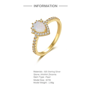 Macro detail of gold S925 sterling silver ring with pear pearl and AAAAA zirconia stones