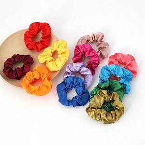 Set of 12 colorful satin scrunchies with elegant silk texture for women hair styling