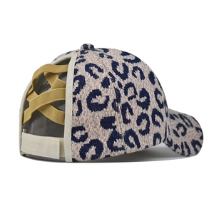 Detail of leopard print baseball cap with criss-cross elastic bands for high ponytails