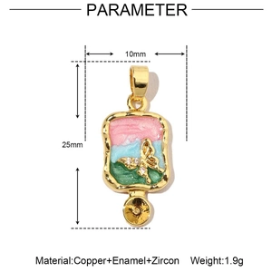 Detail shot of 18k gold plated floral pendant with enamel butterfly and zircon size specs